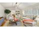 Bright living room with vaulted ceiling, modern light fixture, and comfortable seating arrangement at 850 Moores Mill Nw Rd, Atlanta, GA 30327