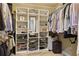 Well-organized walk-in closet with custom shelving, hanging rods, and storage solutions for clothing and accessories at 850 Moores Mill Nw Rd, Atlanta, GA 30327