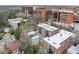 Aerial shot of the neighborhood with a mix of well-maintained brick apartment buildings surrounded by green spaces and city buildings at 1903 Anjaco Nw Rd # 3, Atlanta, GA 30309