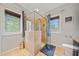 Bright bathroom showcasing a tiled glass shower, dual windows and a contemporary toilet at 1903 Anjaco Nw Rd # 3, Atlanta, GA 30309