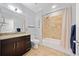 Neutral bathroom with a granite vanity, dark wood cabinets, and tiled shower-tub combination at 1903 Anjaco Nw Rd # 3, Atlanta, GA 30309