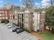 Multi-story brick building featuring balconies, manicured landscaping, and ample parking, offering a blend of comfort and convenience at 1903 Anjaco Nw Rd # 3, Atlanta, GA 30309