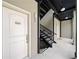 Hallway leading to stairs provides access to upper units, enhancing the building's layout at 1903 Anjaco Nw Rd # 3, Atlanta, GA 30309