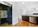 View of kitchen with stacked laundry area, granite countertops and open floor plan at 1903 Anjaco Nw Rd # 3, Atlanta, GA 30309