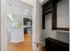 Open concept kitchen with dark cabinetry and stainless appliances viewed from a doorway at 1903 Anjaco Nw Rd # 3, Atlanta, GA 30309