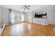 Living room features hardwood floors, large windows, and open access to kitchen at 1903 Anjaco Nw Rd # 3, Atlanta, GA 30309