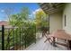 Relaxing patio with a wood table, chairs, and an overhead fan overlooking lush greenery at 1903 Anjaco Nw Rd # 3, Atlanta, GA 30309