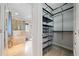 Organized walk-in closet featuring metal shelving and ample storage space for clothing and accessories at 1903 Anjaco Nw Rd # 3, Atlanta, GA 30309