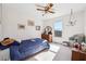 Well-lit bedroom with a ceiling fan, dresser, and sunny window at 3200 Fence Rd, Dacula, GA 30019