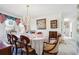 Elegant dining room featuring a chandelier, large table, and decorative accents at 3200 Fence Rd, Dacula, GA 30019