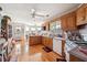 Spacious kitchen with oak cabinetry, modern appliances, and a seamless transition to the breakfast nook at 3200 Fence Rd, Dacula, GA 30019