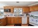 Functional kitchen featuring oak cabinets, modern appliances, and plenty of counter space at 3200 Fence Rd, Dacula, GA 30019