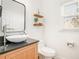 Chic powder room with vessel sink, wood vanity, and stylish mirror at 3215 Belford Dr, Marietta, GA 30066