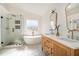 Spa-like bathroom with soaking tub, glass shower, and double sink vanity at 3215 Belford Dr, Marietta, GA 30066