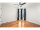 Bedroom featuring modern ceiling fan, hardwood floors, and large windows at 3215 Belford Dr, Marietta, GA 30066