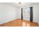 Empty bedroom with natural lighting, hardwood floors, and modern light fixture at 3215 Belford Dr, Marietta, GA 30066