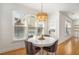 Cozy dining area featuring a modern chandelier and bright natural light at 3215 Belford Dr, Marietta, GA 30066