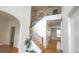 Inviting foyer featuring a staircase with natural wood treads and black metal balusters, complemented by pristine white walls at 3215 Belford Dr, Marietta, GA 30066