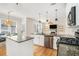 Open-concept kitchen featuring granite counters and a view to the living area at 3215 Belford Dr, Marietta, GA 30066