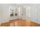 Light-filled bedroom with hardwood floors, white walls, and a view of the front yard at 3215 Belford Drive, Marietta, GA 30066