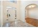 Bright and airy foyer featuring tile flooring, white walls, and an arched doorway at 3215 Belford Drive, Marietta, GA 30066