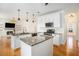 Modern eat-in kitchen with granite countertops, stainless appliances, and white cabinetry at 3215 Belford Drive, Marietta, GA 30066