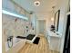 Modern bathroom featuring a soaking tub, glass enclosed shower with rainfall shower head, and marble countertops at 590 Hood Ave, Fayetteville, GA 30214