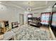 bedroom showcasing a bunk bed, large gray shag rug, unique chandelier, and whimsical decor at 590 Hood Ave, Fayetteville, GA 30214