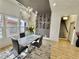 Bright dining area featuring modern table, chandelier lighting, and view of the outdoor living space at 590 Hood Ave, Fayetteville, GA 30214