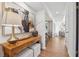 Stylish hallway showcases a wooden console table, decor, and leads to the living room at 886 Cedar Creek Se Ct, Marietta, GA 30067