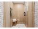 Contemporary shower featuring neutral tile, glass door, and a built-in niche for toiletries at 886 Cedar Creek Se Ct, Marietta, GA 30067