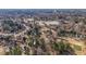 Expansive aerial view of a residential home near a serene lake, surrounded by trees and other residences in the neighborhood at 9937 Between The Grns, Villa Rica, GA 30180