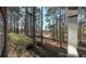 Wooded backyard with mature trees and view of the golf course at 9937 Between The Grns, Villa Rica, GA 30180