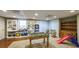 Well-lit basement recreation area with a foosball table and playful decor at 9937 Between The Grns, Villa Rica, GA 30180