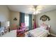 bedroom featuring a pink dollhouse, unicorn bed, and blue curtains for a playful atmosphere at 9937 Between The Grns, Villa Rica, GA 30180