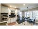 Bright and modern kitchen with white cabinets, stainless steel appliances, and a center island at 9937 Between The Grns, Villa Rica, GA 30180