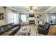 Cozy living room with a fireplace, TV, leather furniture, and stylish decor at 9937 Between The Grns, Villa Rica, GA 30180