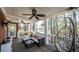 Relaxing porch featuring ceiling fan, outdoor seating, and peaceful outdoor views at 9937 Between The Grns, Villa Rica, GA 30180