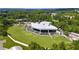 Aerial view of an outdoor music venue including covered seating, large lawn area, and surrounding parking at 10 Claire Se Dr, Atlanta, GA 30315