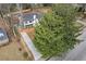 Aerial view of the home with a long driveway and mature trees, offering curb appeal and shade at 10 Claire Se Dr, Atlanta, GA 30315