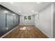 Spacious finished basement with wood floors, ample lighting, and neutral walls, perfect for versatile use at 10 Claire Se Dr, Atlanta, GA 30315