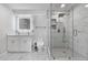 Bathroom featuring dual sinks, large glass shower, and tile floors at 10 Claire Se Dr, Atlanta, GA 30315
