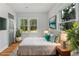 Bright bedroom with hardwood floors, large windows, and a cozy rug at 10 Claire Se Dr, Atlanta, GA 30315