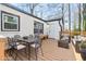 Outdoor seating area on a wood deck with modern furniture at 10 Claire Se Dr, Atlanta, GA 30315