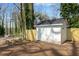 Backyard shed provides ample storage space, complemented by a newly installed wooden fence at 10 Claire Se Dr, Atlanta, GA 30315
