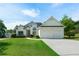 Charming two-story home with an attached two-car garage and a well-manicured lawn at 3047 Standing Rock Ct, Lithia Springs, GA 30122