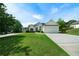 Charming two-story home with an attached two-car garage and a well-manicured lawn at 3047 Standing Rock Ct, Lithia Springs, GA 30122