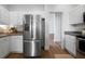 Modern kitchen featuring stainless steel refrigerator and white cabinets at 3047 Standing Rock Ct, Lithia Springs, GA 30122