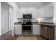 Kitchen featuring stainless steel oven, microwave, dishwasher and white subway tile backsplash at 3047 Standing Rock Ct, Lithia Springs, GA 30122