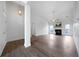Bright, airy living room featuring a fireplace, high ceilings and beautiful wood-look floors at 3047 Standing Rock Ct, Lithia Springs, GA 30122